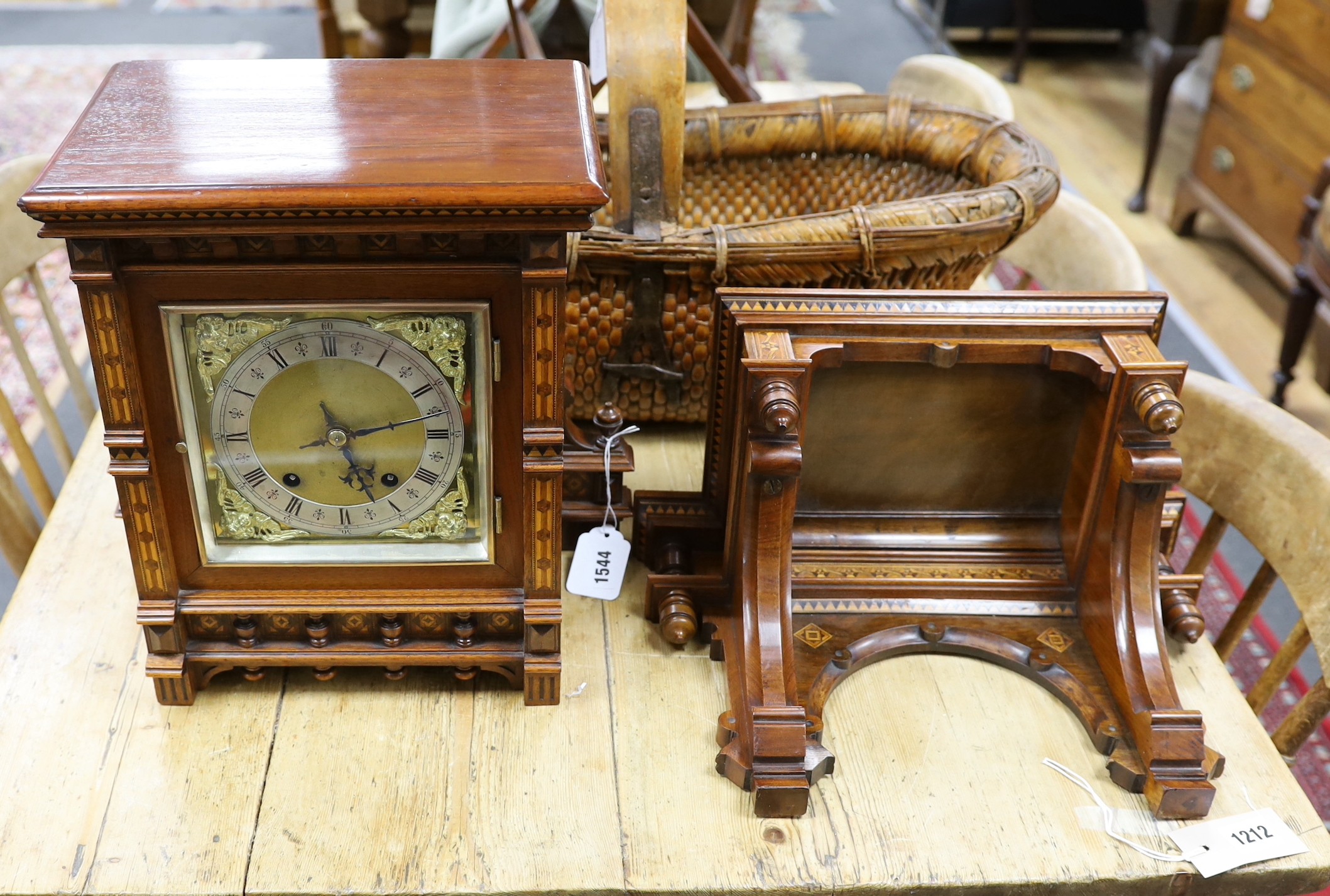 A late 19th century Arts and Crafts walnut and marquetry banded Tunbridgeware bracket clock with a German eight day quarter striking movement and bracket, clock 25cms wide x 35cms high, bracket 39cms wide x 26cms high